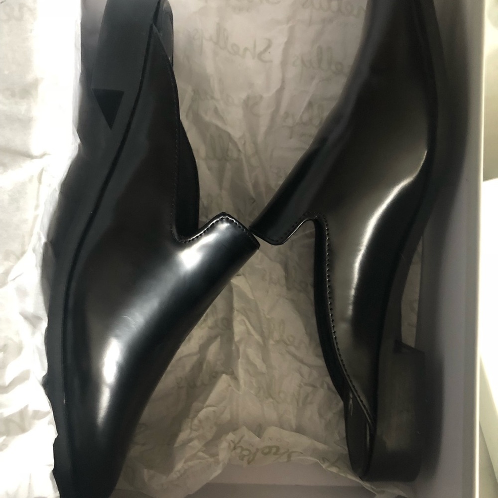black faux leather mules